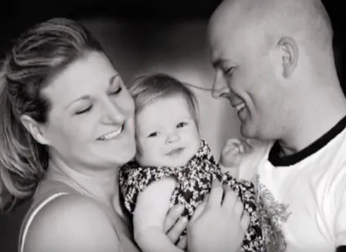 A black-and-white portrait of Hannah, looking away from the camera.